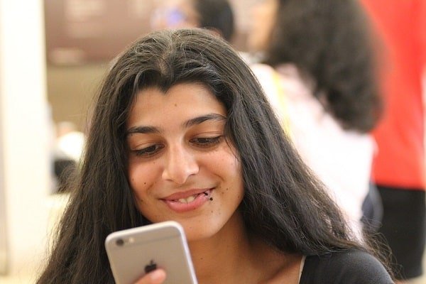 Lady face glued to her mobile phone