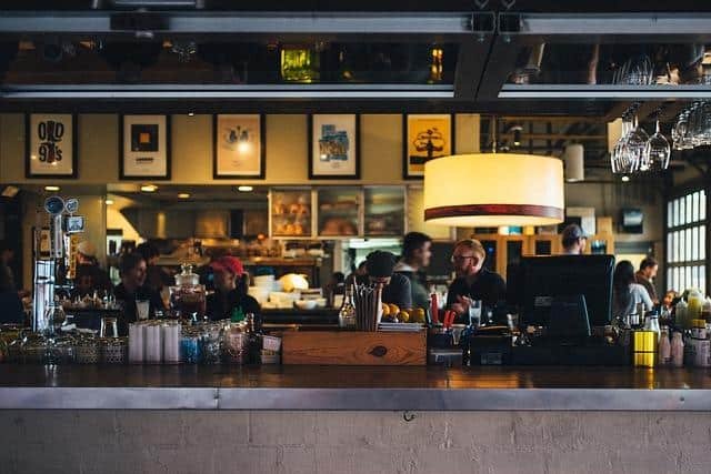 One of the most iconic bars in Manhattan with people chatting and drinking.
